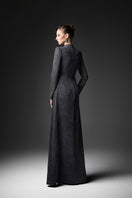 Black long sleeve gown by GVLUX, Midnight Fireworks design, elegant evening dress with intricate pattern and flowing fabric.