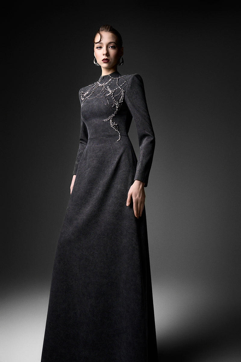 Black long sleeve gown from GVLUX Midnight Fireworks collection, elegant evening dress with intricate design details.