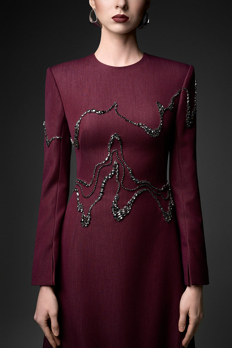 Long sleeve ox embroidered gown by GVLUX featuring intricate embroidery and elegant design, perfect for formal occasions.