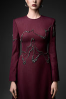 Long sleeve ox embroidered gown by GVLUX featuring intricate embroidery and elegant design, perfect for formal occasions.