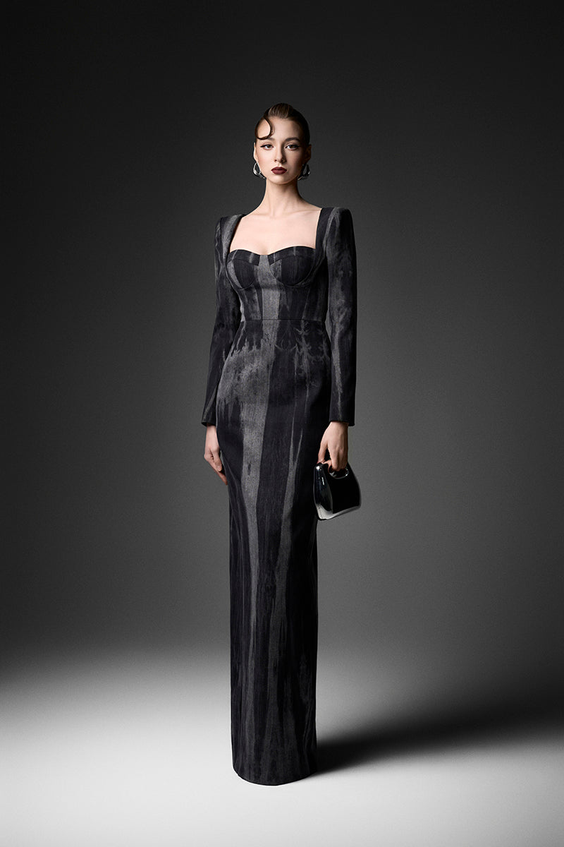 Elegant midnight blue long sleeve gown by GVLUX featuring flowing fabric and intricate design, perfect for formal occasions.