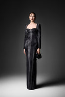 Elegant midnight blue long sleeve gown by GVLUX featuring flowing fabric and intricate design, perfect for formal occasions.