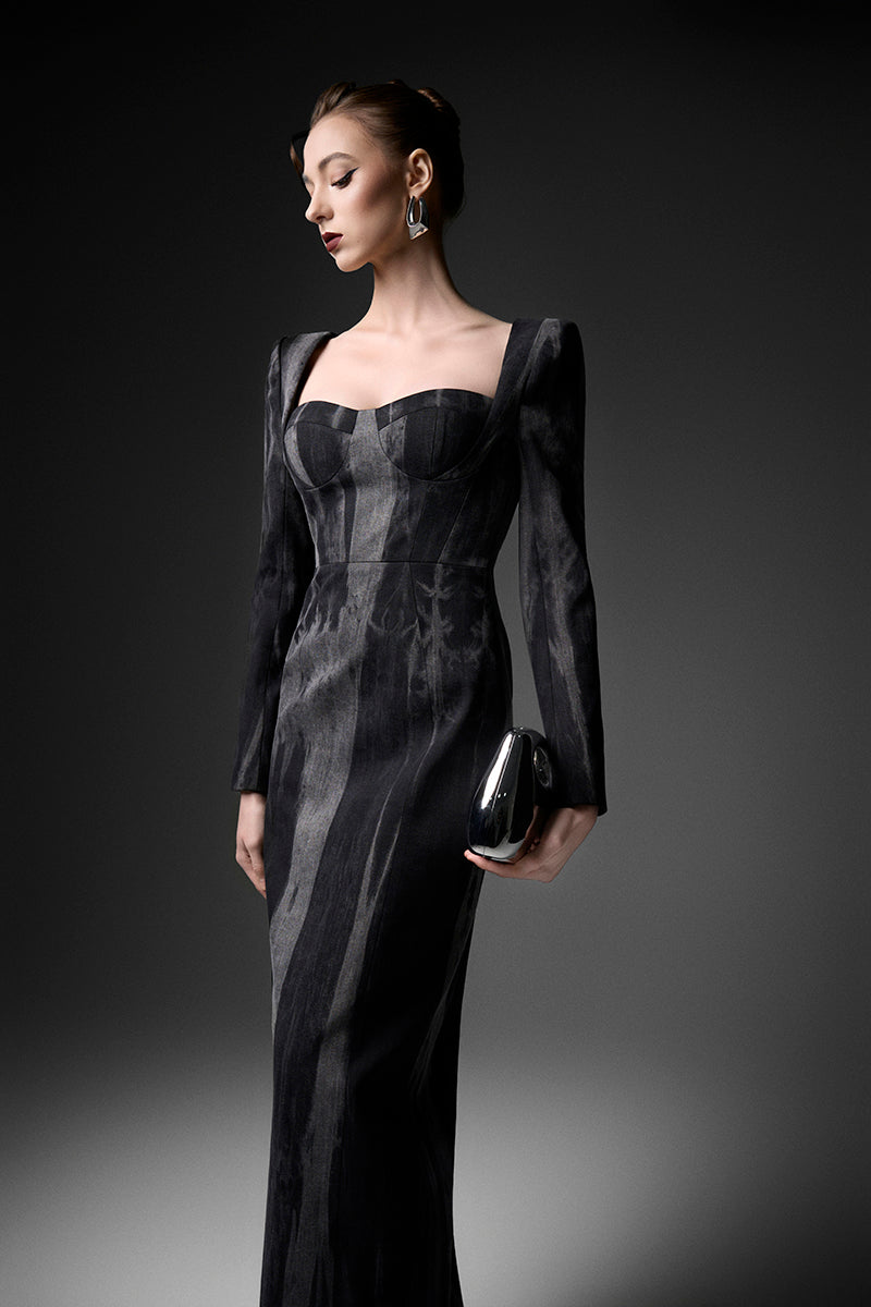 Elegant midnight blue long sleeve gown by GVLUX, featuring flowing fabric and a sophisticated design for formal occasions.