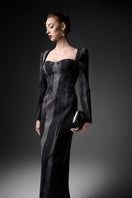 Elegant midnight blue long sleeve gown by GVLUX, featuring flowing fabric and a sophisticated design for formal occasions.