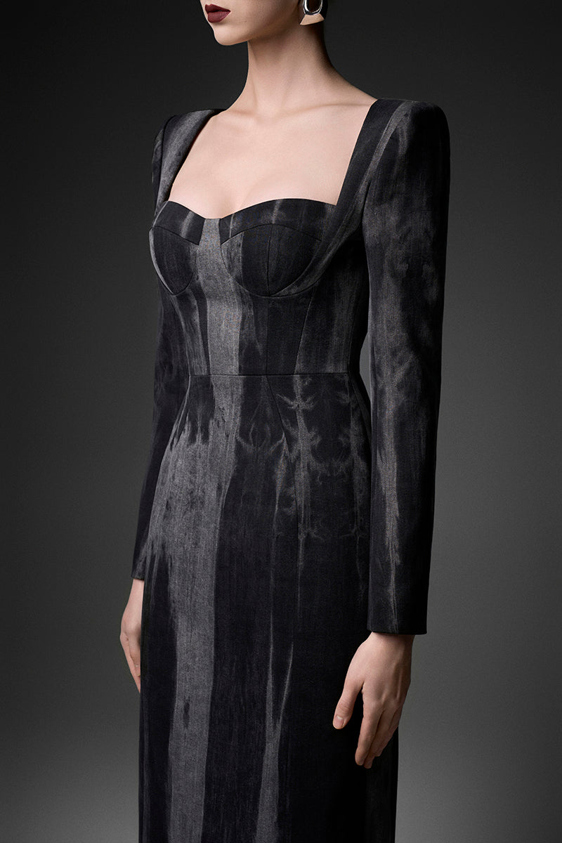 Elegant midnight blue long sleeve gown by GVLUX, featuring flowing fabric and intricate design details.