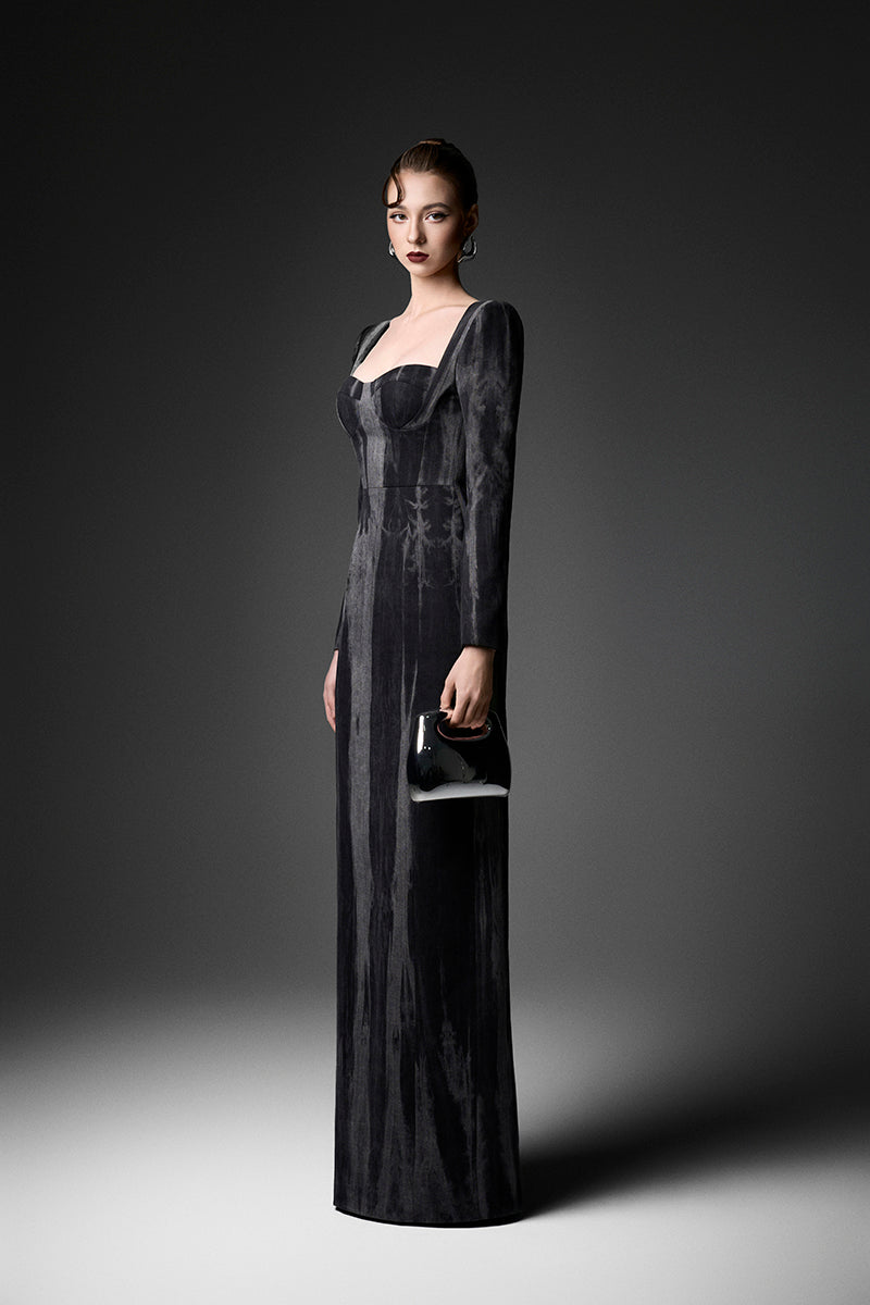 Elegant midnight blue long sleeve gown by GVLUX, featuring flowing fabric and subtle detailing for a sophisticated look.