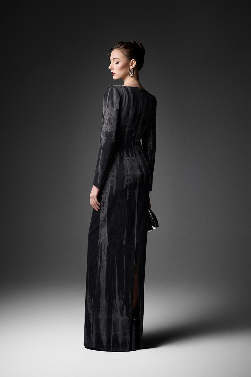 Elegant midnight blue long sleeve gown by GVLUX featuring flowing fabric and intricate detailing, perfect for formal occasions.