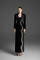 Black deep V-neck tailored sheath gown by GVLUX, fitted design with elegant long sleeves and sleek silhouette.