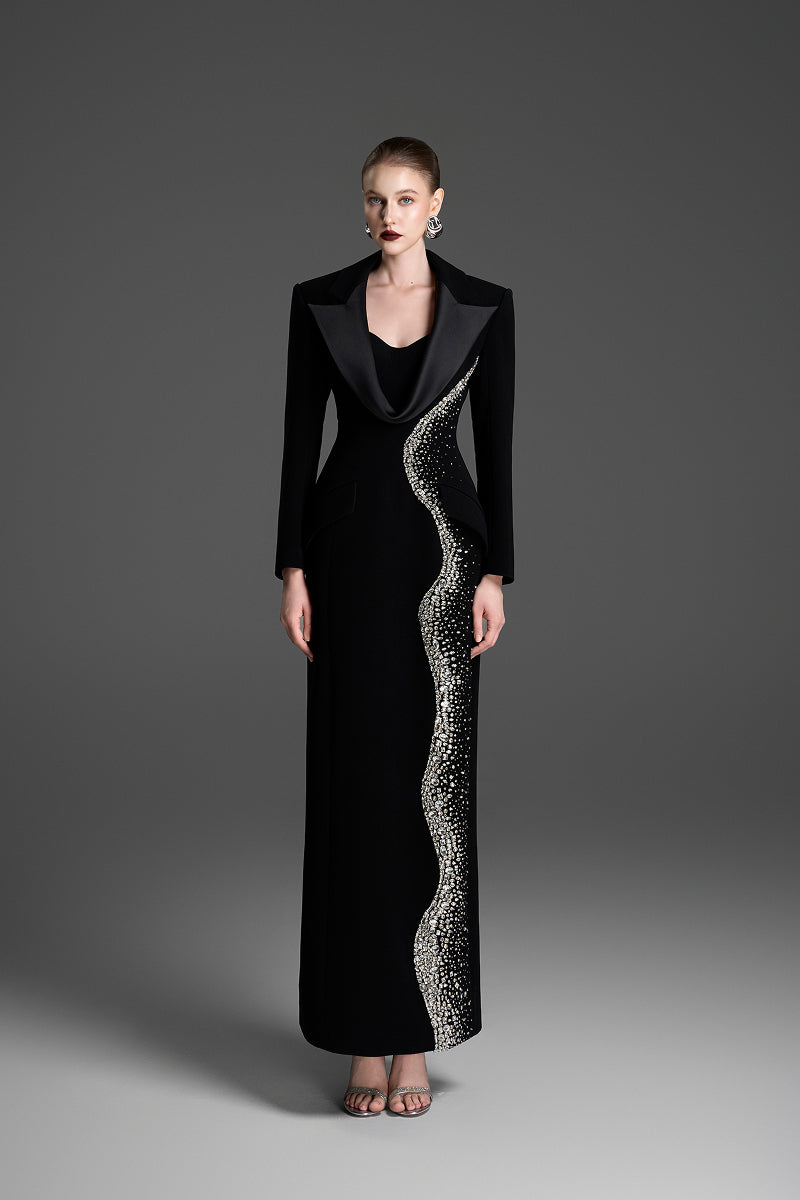 Black deep V-neck tailored sheath gown by GVLUX, fitted design with elegant long sleeves and sleek silhouette.