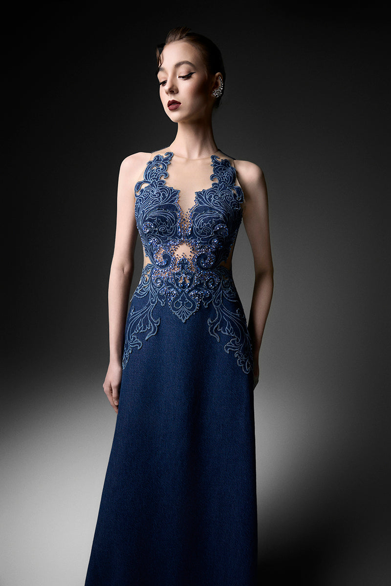 Navy high-neck embroidered gown by GVLUX, flowing fabric with intricate embroidery, elegant evening wear for special occasions.