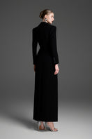 Black deep V-neck tailored sheath gown by GVLUX, featuring sleek fit and elegant design suitable for formal occasions.