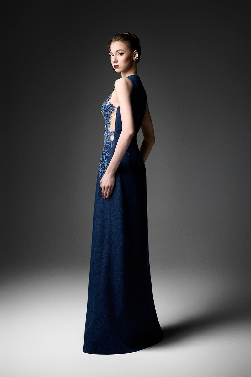 Navy embroidered high neck gown by GVLUX with intricate embroidery, flowing fabric, and elegant design suitable for formal occasions.