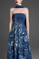 Blue strapless gown with crystal-embroidered marblewood details by GVLUX, elegant formal dress for special occasions.