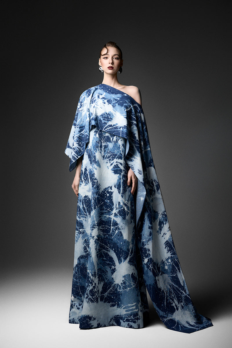 Elegant off-shoulder gown by GVLUX featuring flowing fabric and a stylish design, perfect for formal occasions.