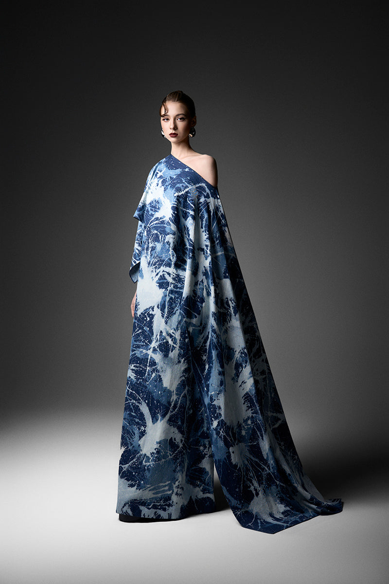 Elegant off-shoulder gown by GVLUX featuring flowing fabric and a sophisticated design, perfect for formal occasions.
