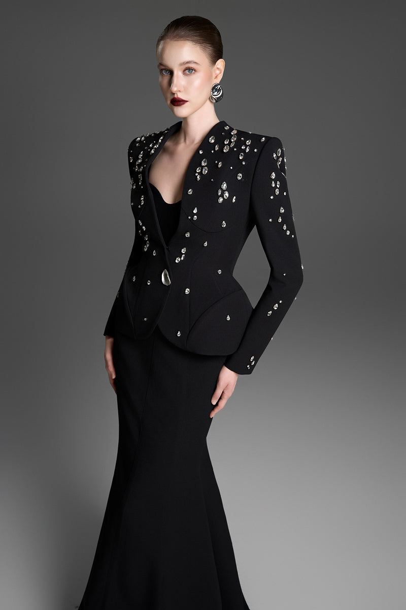 Black collarless paneled vest with curved flared waist by GVLUX, stylish sleeveless top perfect for layered outfits.