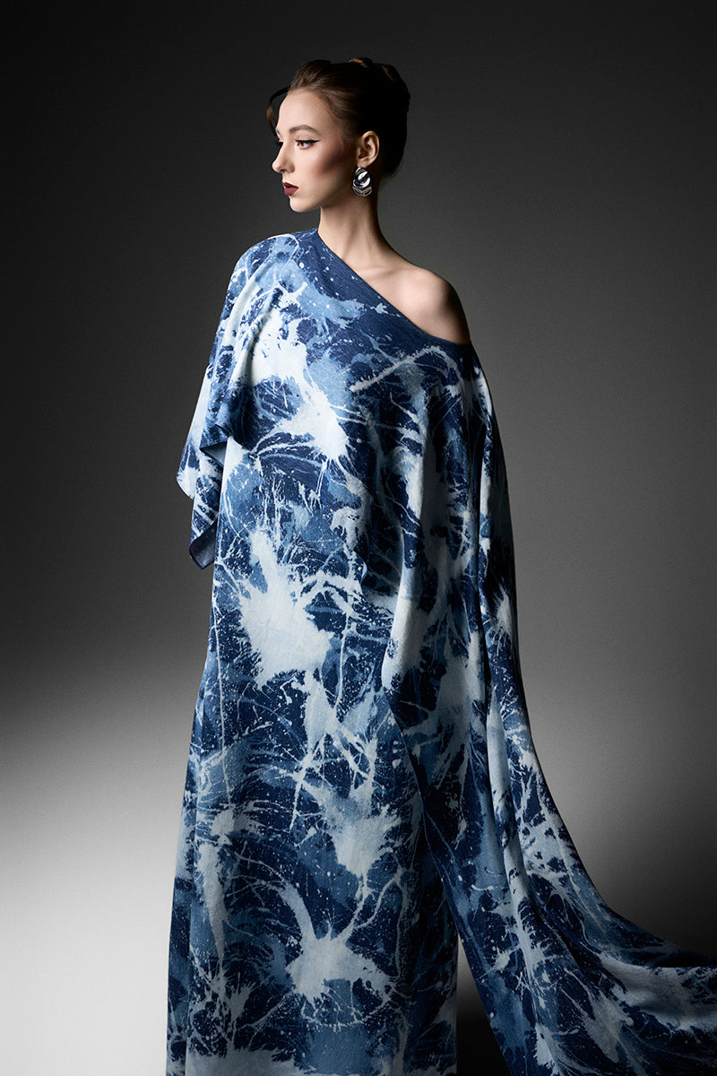 Elegant off-shoulder gown by GVLUX featuring flowing fabric and a sophisticated design, perfect for formal occasions.