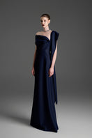 Dark blue A-line gown by GVLUX, featuring a flowing silhouette and elegant design, perfect for formal occasions.