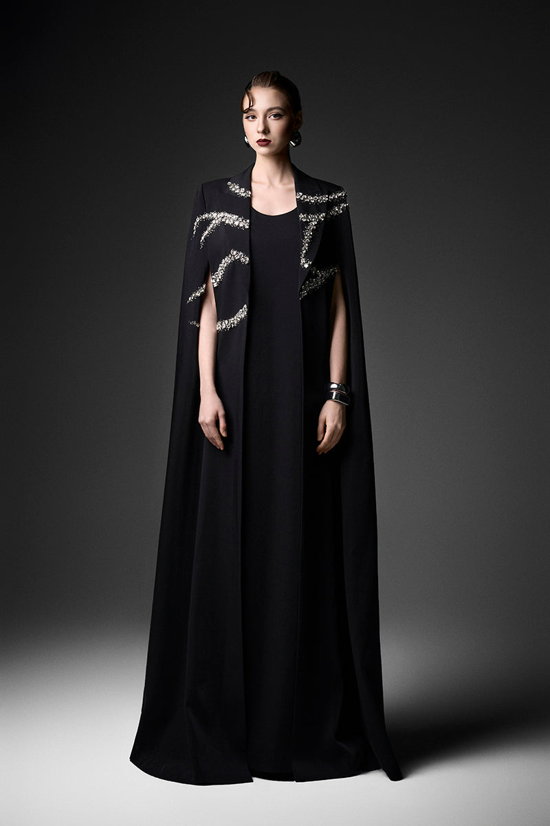 Embroidered black high-neck gown by GVLUX featuring intricate embroidery and elegant design, perfect for formal occasions.