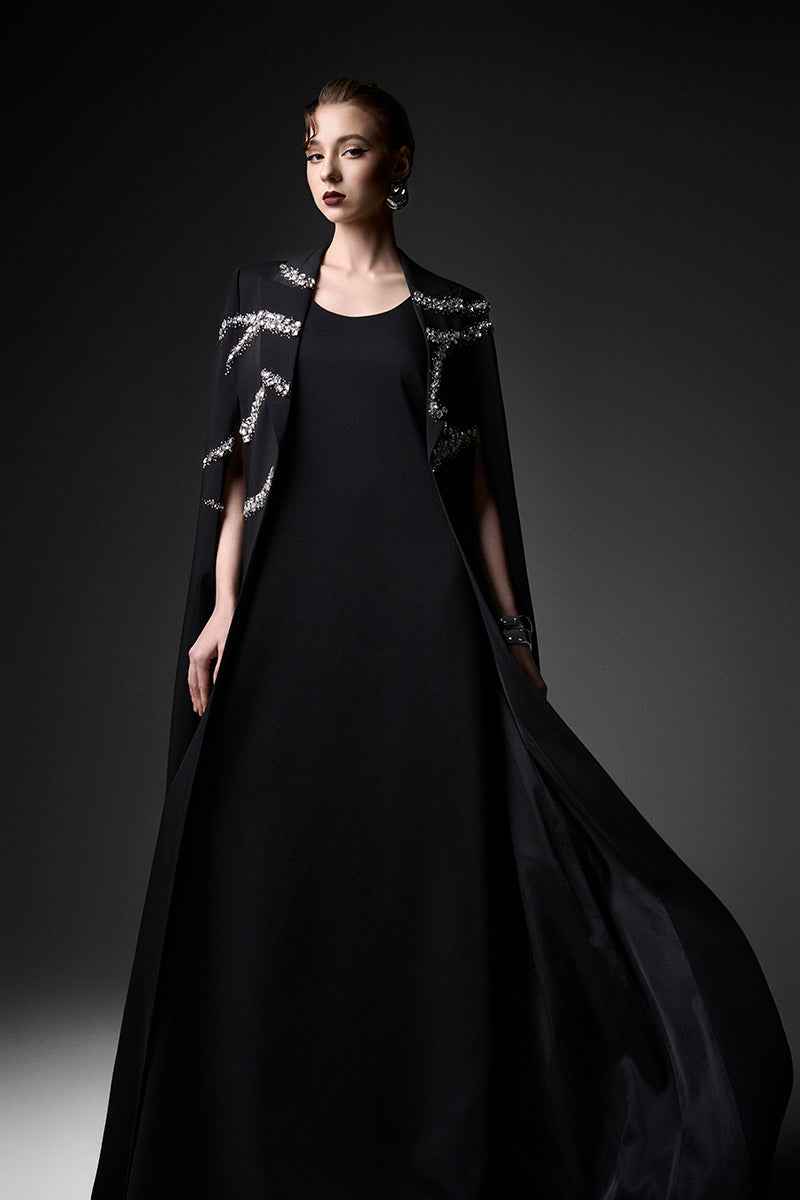 Black embroidered high neck gown by GVLUX featuring intricate embroidery and elegant design, showcasing a sophisticated evening look.