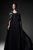 Black embroidered high neck gown by GVLUX featuring intricate embroidery and elegant design, showcasing a sophisticated evening look.