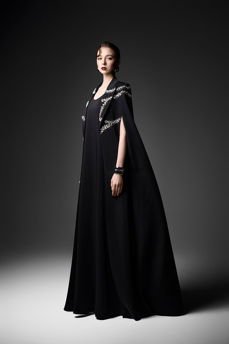 Black embroidered high neck gown from GVLUX, featuring intricate embroidery and elegant high neckline, perfect for formal occasions.