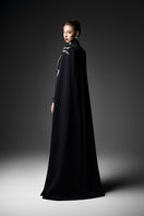 Black embroidered high-neck gown by GVLUX, featuring intricate embroidery and elegant design, displayed on a mannequin.