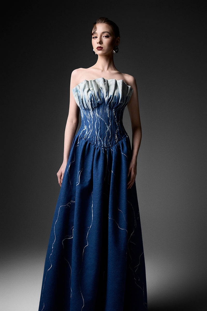 Elegant black strapless gown by GVLUX with a fitted bodice and flowing skirt, perfect for formal occasions.