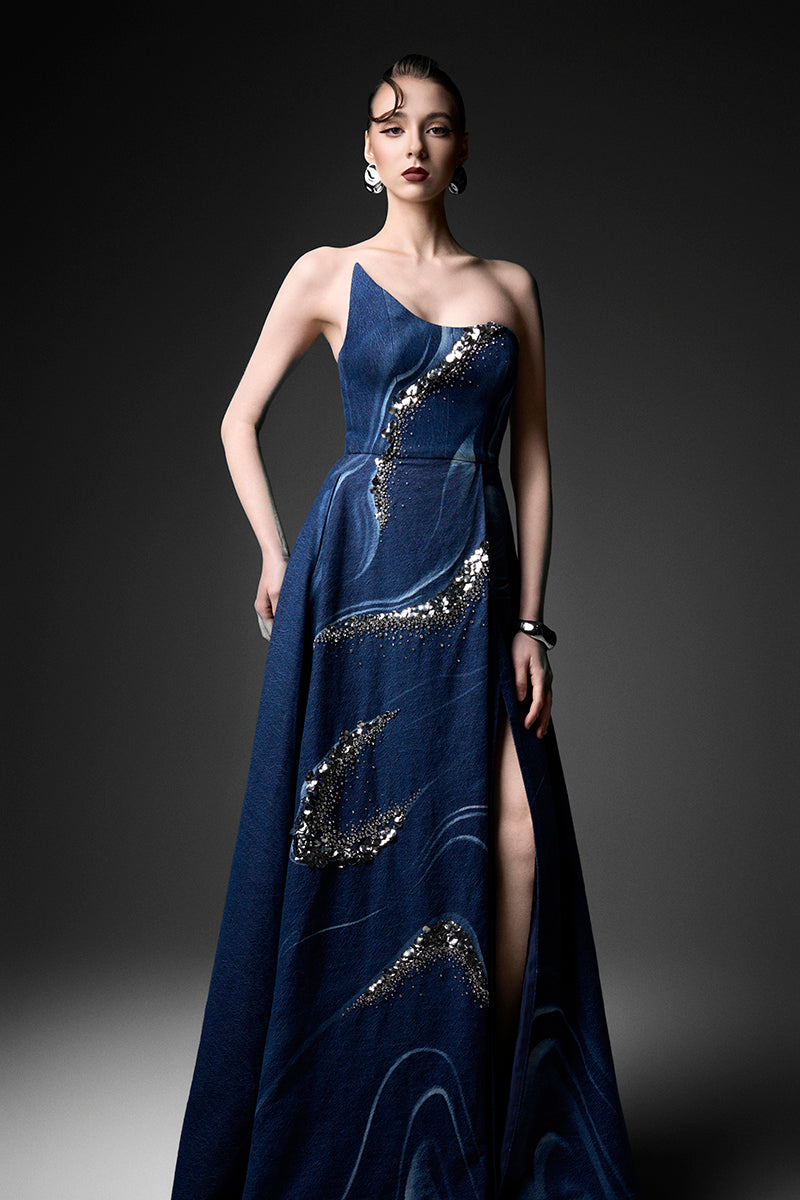 Elegant watercolor embroidery one-shoulder gown by GVLUX featuring intricate design and flowing fabric.