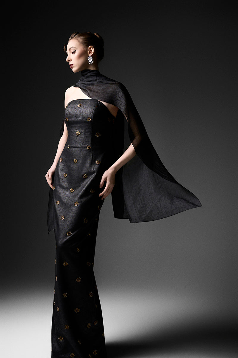 Black cape neck sweetheart gown by GVLUX featuring a flowing silhouette and elegant design, perfect for formal occasions.