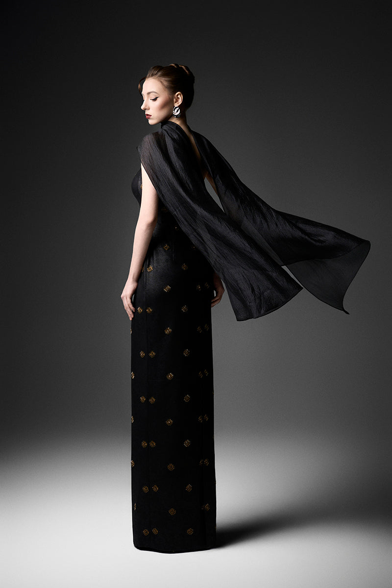 Black cape neck sweetheart gown by GVLUX featuring a flowing silhouette and elegant design, perfect for formal occasions.