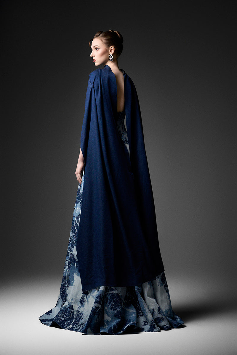 Water Works Cape Gown by GVLUX, light blue fabric with water-themed design, designed for protective and stylish wear.