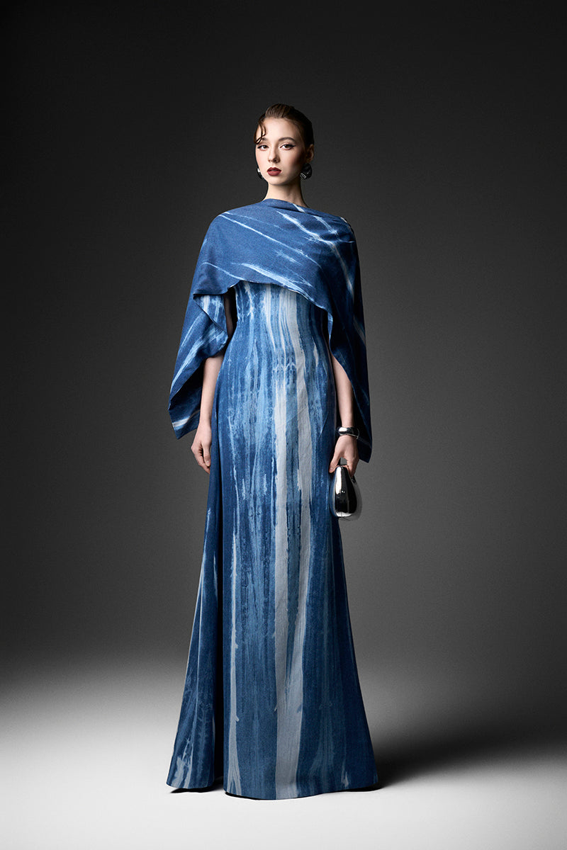 Elegant water ripples cape neck gown by GVLUX, flowing fabric with a stylish cape neckline, perfect for formal occasions.