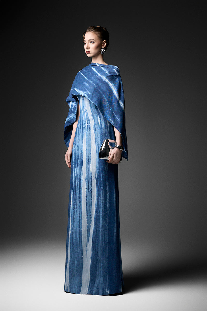 Elegant water ripples cape neck gown by GVLUX, featuring flowing fabric and sophisticated design for formal occasions.