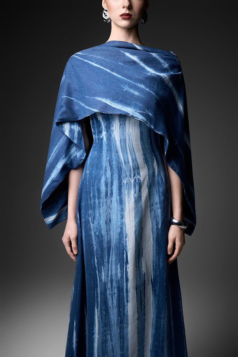 Elegant water ripples cape neck gown by GVLUX, featuring flowing fabric and stylish cape neckline for formal occasions.
