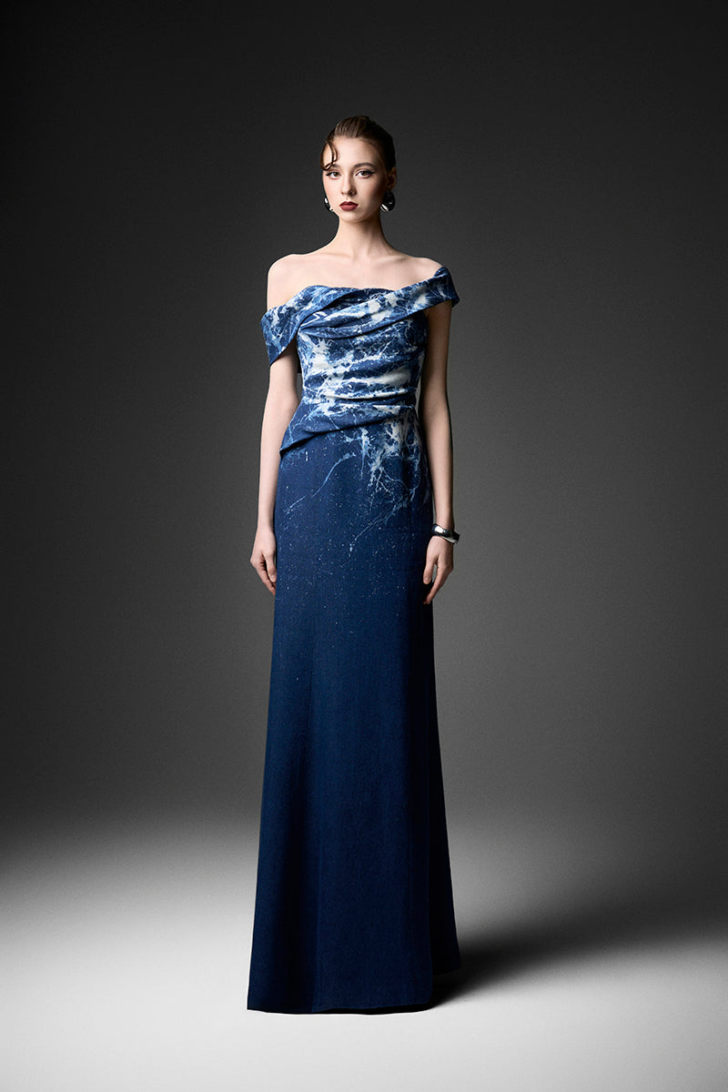 Elegant off-shoulder gown by GVLUX with water ripple design, featuring flowing fabric and a sophisticated silhouette.