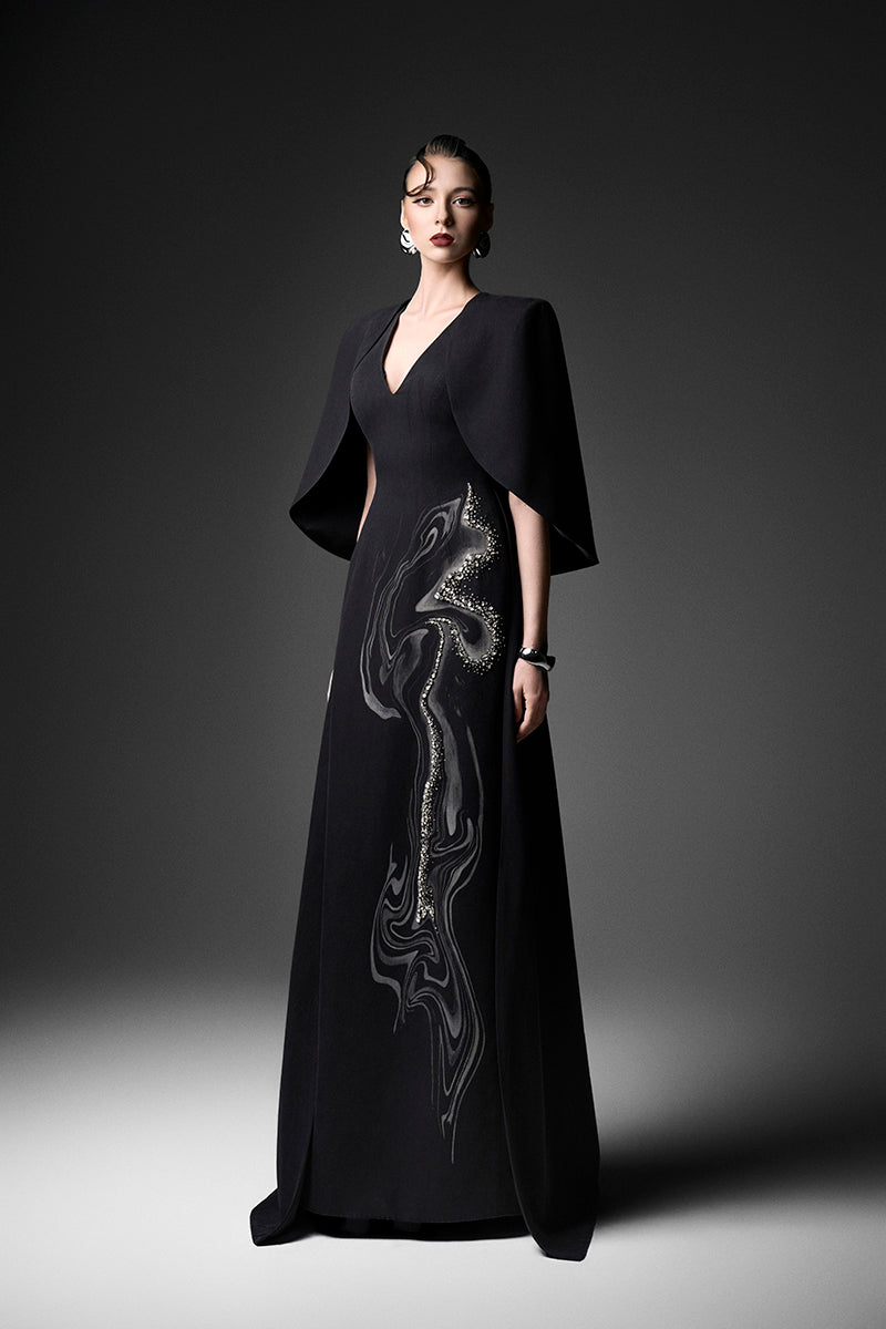 Elegant midnight firework-themed V-neck gown by GVLUX, featuring intricate design details and flowing fabric.