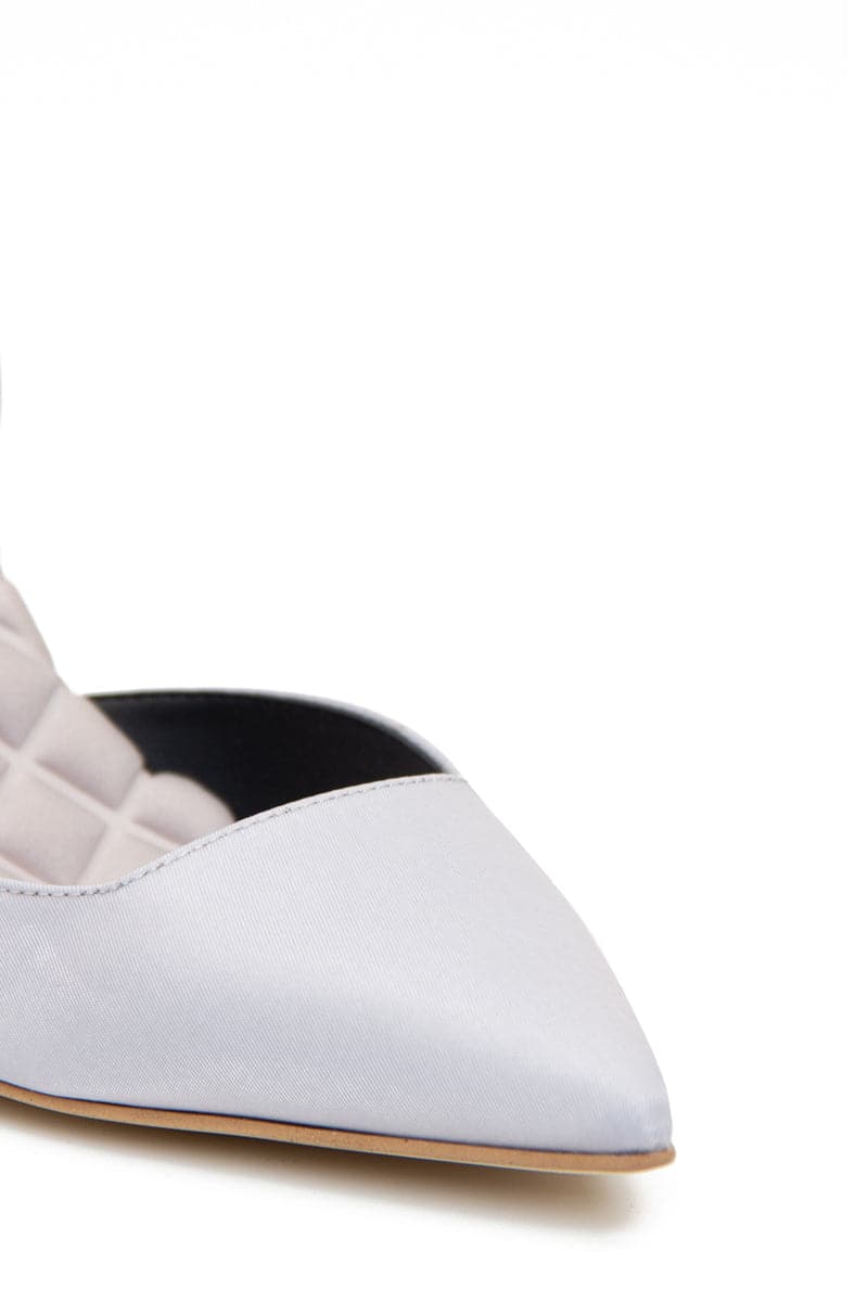 A pair of AERA Gabriella gray satin slingback heels with pointed toes and elegant design, shown from the front.