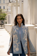 Nadya Shah Gabriel in Denim Dream Cape, stylish blue denim jacket with a flowing cape design, perfect for casual wear.