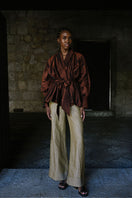 ANA + MARIA GALA top in mahogany, showing a stylish sleeveless blouse with a high neckline and soft fabric detail.
