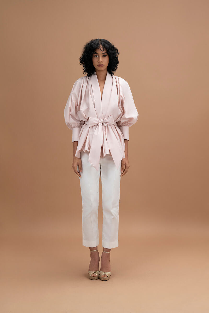 Light pink Gala top by ANA + MARIA, featuring a stylish design and soft fabric, shown on a neutral background.