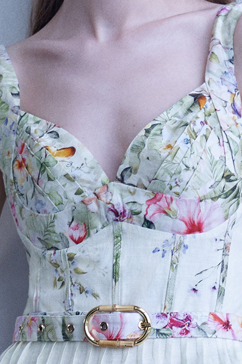 AISA Gardenia floral midi dress displayed on a hanger, featuring a flowy fabric and vibrant botanical print.