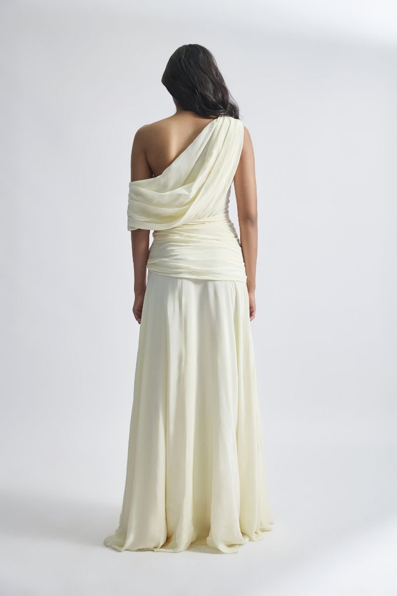 Off-white GEMMA gown by Deme By Gabriella featuring elegant fabric and a flowing silhouette, perfect for formal occasions.