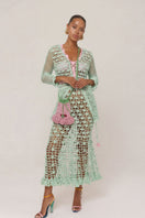 Light mint handmade crochet shirt by Andreeva, showcasing intricate crochet patterns and a stylish fit.