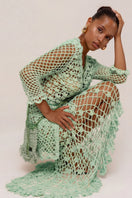 Andreeva California Mint handmade knit midi skirt showing soft mint green fabric and fitted waist with knee-length design.