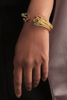 Gold GEO Emerald bracelet by Fenomena featuring a sleek design with vibrant emerald stones and elegant gold setting.