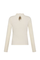 Nelblu Kaia beige top, lightweight and stylish, shown on a hanger with soft fabric details and a relaxed fit.