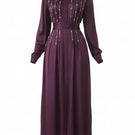 Elegant aubergine maxi dress by MASTANI with intricate embellishments, featuring a flowing silhouette and detailed embroidery.