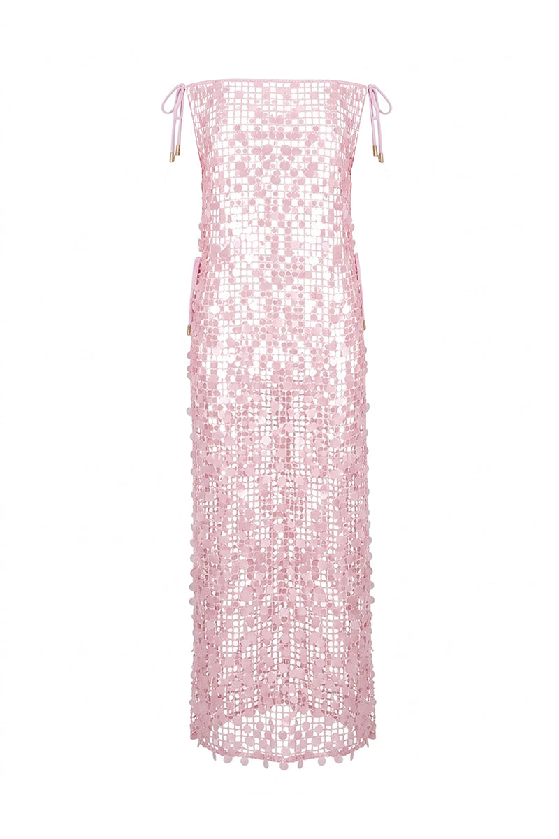 Nur Karaata Royal Poinciana maxi dress on ghost mannequin, flowy fabric, floral pattern, sleeveless design, elegant evening wear.