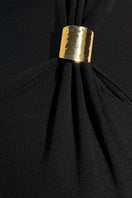 Black SemSem jersey top with gold hardware, showcasing a close-up of the fabric and stylish details on the shoulders.